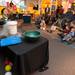 A container of liquid nitrogen freezes a banana and a water balloon as kids watch the Flame and Freezing Science Demo at the Ann Arbor Hands-On Museum Saturday Jan. 5. 
Courtney Sacco I AnnArbor.com 